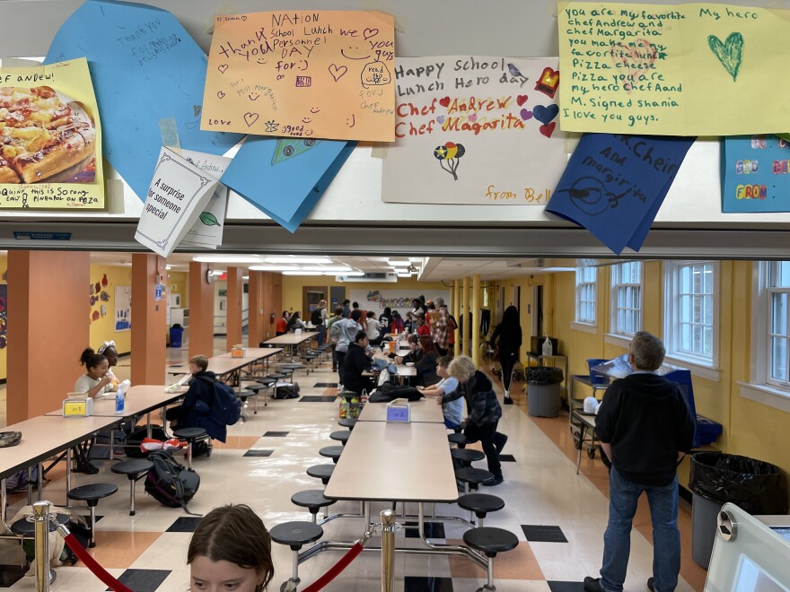 Looking out at the cafeteria from behind the line, with a row of complimentary notes from students.