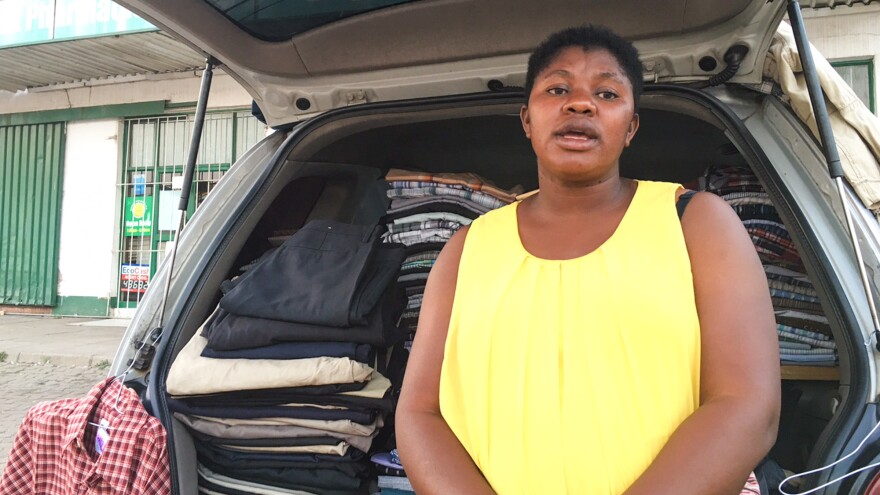 Fortunate Nyakupinda earns a living by selling secondhand clothes from the back of her car.
