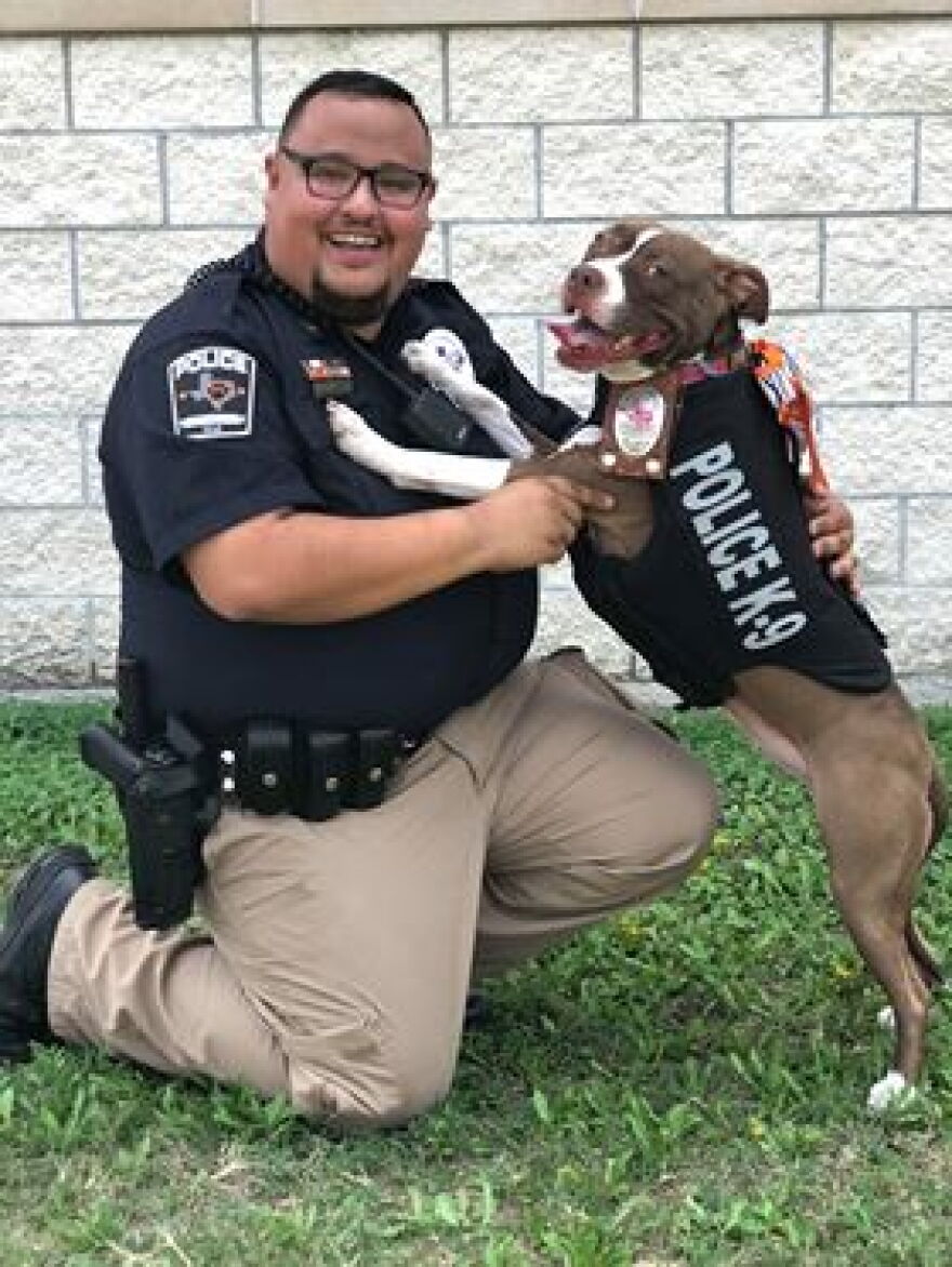 Officer Dave Contreras and Coco are hoping to win a new Chevy Tahoe.