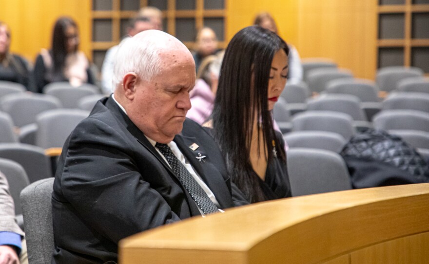 U.S. Representative Ron Estes and Wichita Mayor Lily Wu pray together on Jan. 29. Estes serves as the representative for Kansas's fourth congressional district.