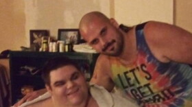 Danny Duncan, left, and his older brother Brandon, right, pose for a picture at their home in Spencer, Indiana. Danny has a severe form of autism, and before the start of the COVID-19 pandemic went to a day program at Stone Belt, a Bloomington nonprofit.