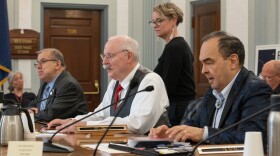 Sen. Lyman Hoffman, D-Bethel, left, Sen. Bert Stedman, R-Sitka, center, and Sen. Donny Olson, D-Golovin, each a co-chair of the Senate Finance Committee, await a conference committee meeting on May 13, 2024. (Eric Stone/Alaska Public Media)
