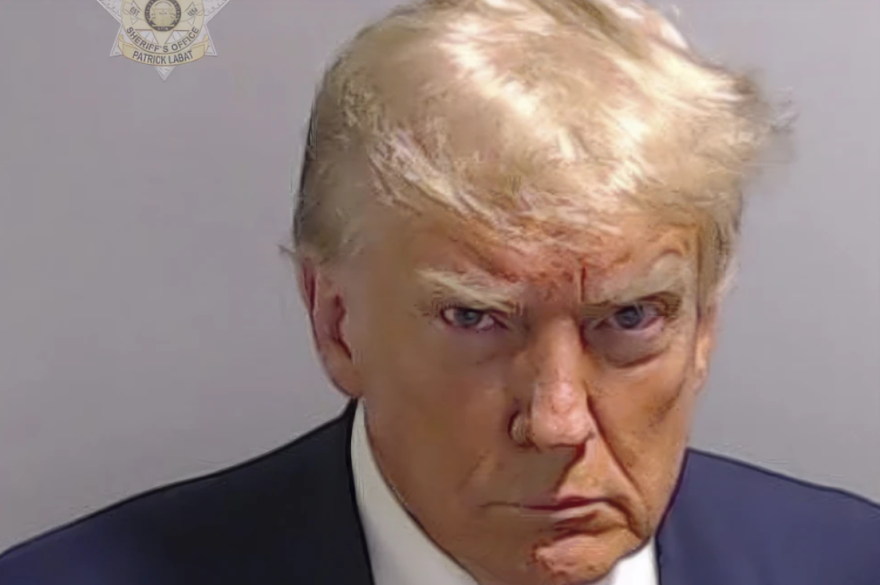 This booking photo provided by Fulton County Sheriff’s Office, shows former President Donald Trump on Thursday, Aug. 24, 2023, after he surrendered and was booked at the Fulton County Jail in Atlanta. Trump is accused by District Attorney Fani Willis of scheming to subvert the will of Georgia voters in a desperate bid to keep Joe Biden out of the White House.