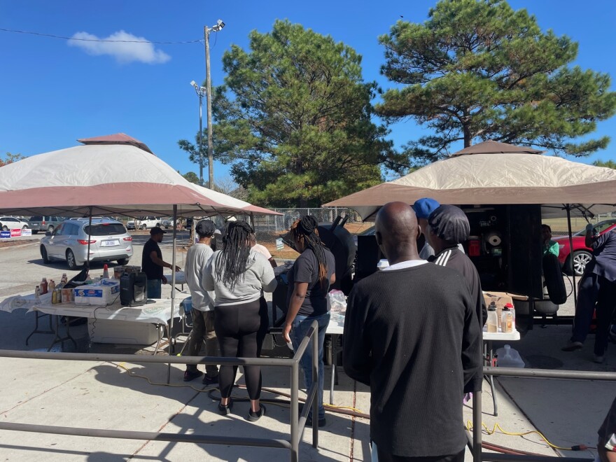 Voters line up to get a free plate of fried fish at Williston, Tuesday, Nov. 5.