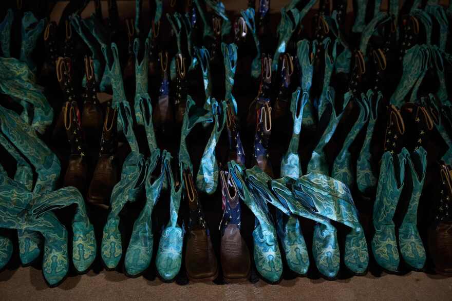 58 pairs of boots representing the number of people killed at the Route 91 music festival were on display at Clark County Government Center Amphitheater in Las Vegas on Oct. 1, 2022.