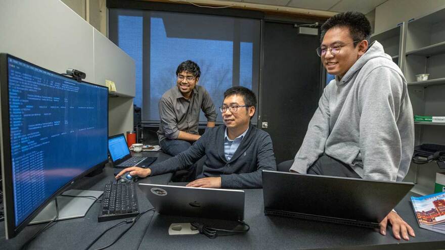 Researchers using a computer
