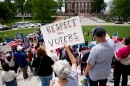 Ann Hayles, of Raymore, Mo., rallies alongside hundreds in support of voter-backed initiatives legalizing abortion and guaranteeing paid sick leave at the Capitol on Thursday.