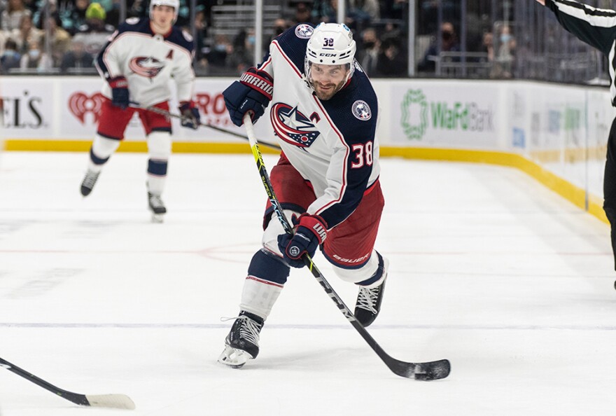  Columbus Blue Jackets center Boone Jenner takes a shot on goal during an NHL hockey game against the Seattle Kraken, Saturday, Dec. 11, 2021, in Seattle. 