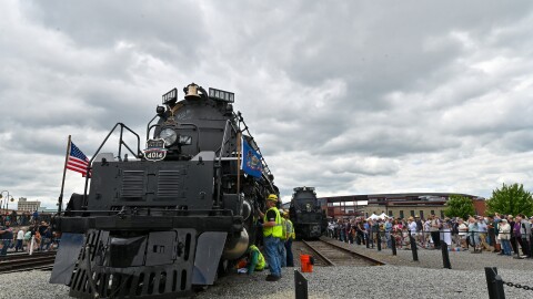 Crews work on Union Pacific's Big Boy locomotive 4014 as people watch at The Steamtown National Historic Site in Scranton.