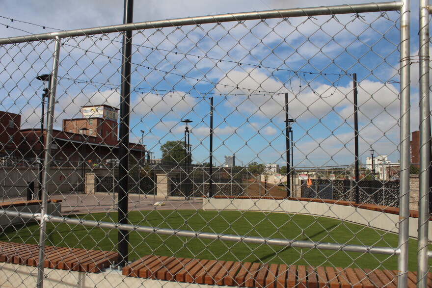 One of two new public spaces with grass carpet and string lights at Jordan Creek in downtown Springfield, Mo. (Photo taken September 11, 2026)