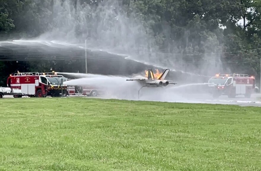 First responders from Naval Air Station Oceana and Virginia Beach fight a simulated F-18 fire during drill Tuesday.