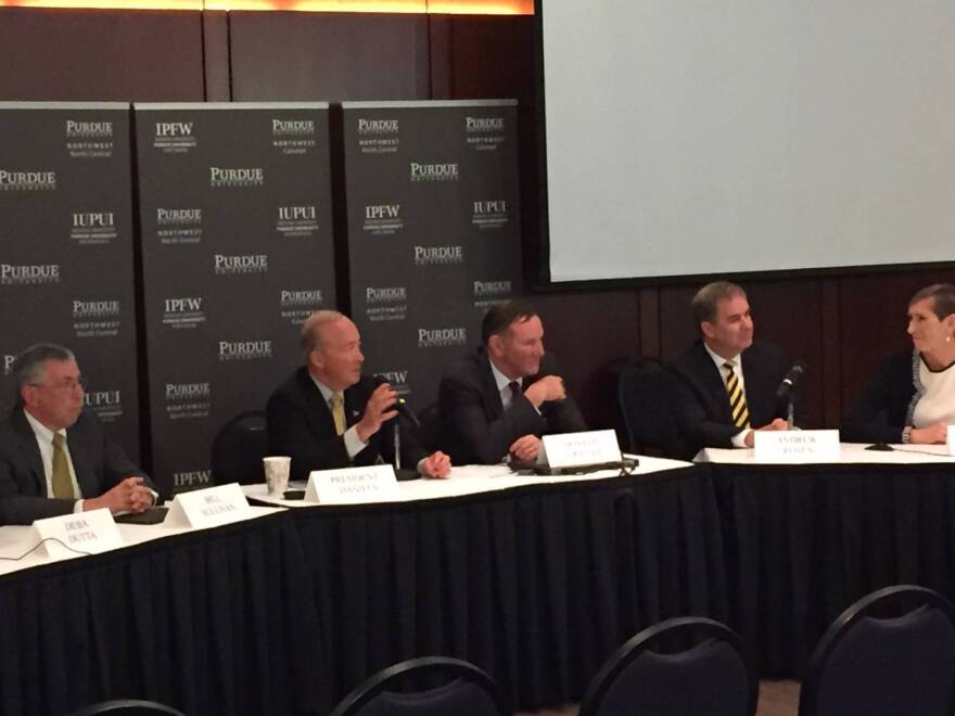Purdue leaders announce the proposed merger earlier this year.