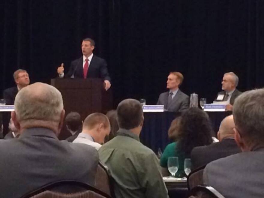 U.S. Rep. Markwayne Mullin (R-Okla. 2) addresses attendees during the 2014 Governor's Water Conference while U.S. Rep. Frank Lucas (R-Okla. 3) and U.S. Rep. James Lankford (R-Okla. 5) look on.
