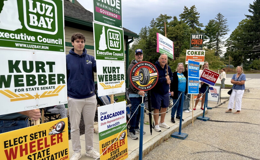 Supporters of various candidates stand outside the polls in Meredith on Sept. 8
