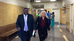 Marq Lewis with We The People Oklahoma walks out of the courtroom with his attorney, Laurie Phillips, after a judge ruled signatures collected in support of a grand jury investigation of the Tulsa County Sheriff's Office are sufficient.