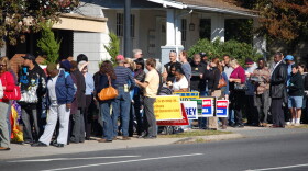 A line of voters waits outside the Plaza Midwood Library in 2008.