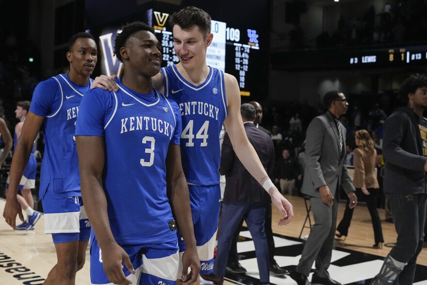 Kentucky guard Adou Thiero (3) and forward Zvonimir Ivisic (44) celebrate the team's 109-77 win against Vanderbilt after an NCAA college basketball game Tuesday, Feb. 6, 2024, in Nashville, Tenn. (AP Photo/George Walker IV)