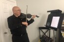 Violinist and teacher Gustavo Correa playing in his home studio in Boca Raton.