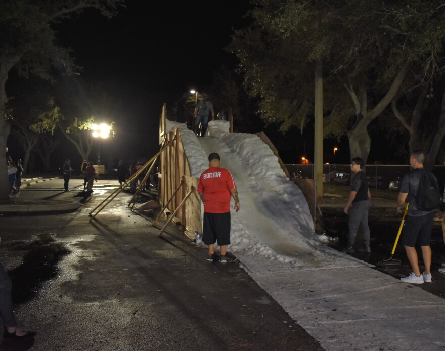 Part of the festival included something kids around here never see- snow generated by a machine and formed into a mini-hill for sledding. 