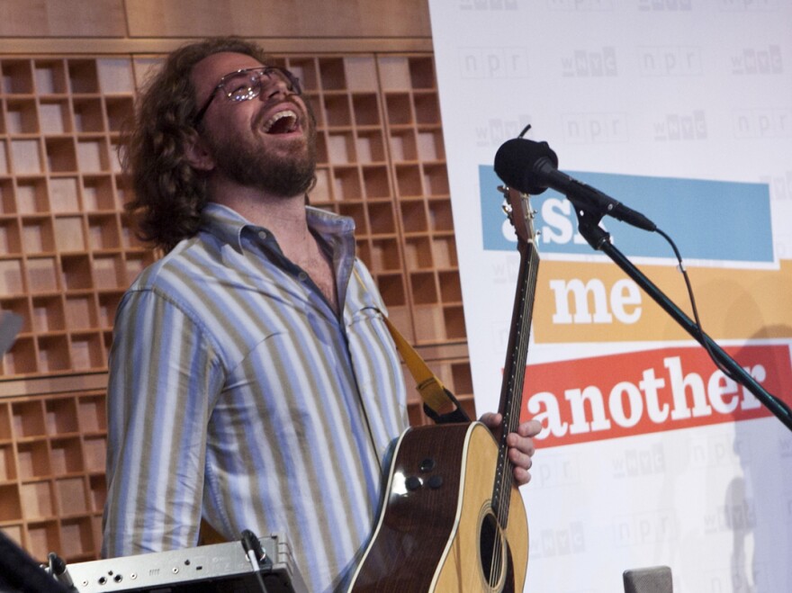 House musician Jonathan Coulton has a laugh while performing on <em>Ask Me Another.</em>