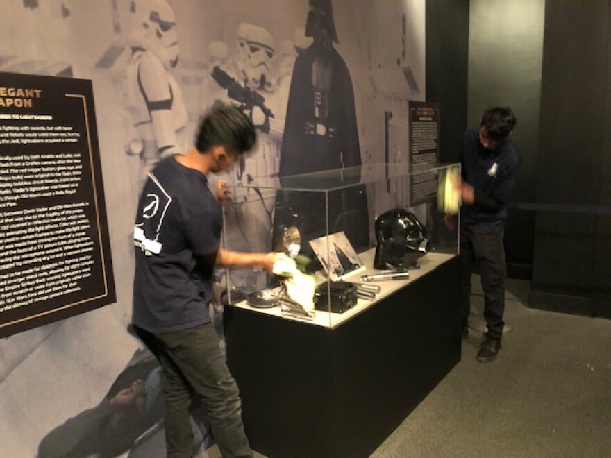 Crews put the finishing touches on one of the display cases of Star Wars movie props at the Ronald Reagan Presidential Library in Simi Valley.