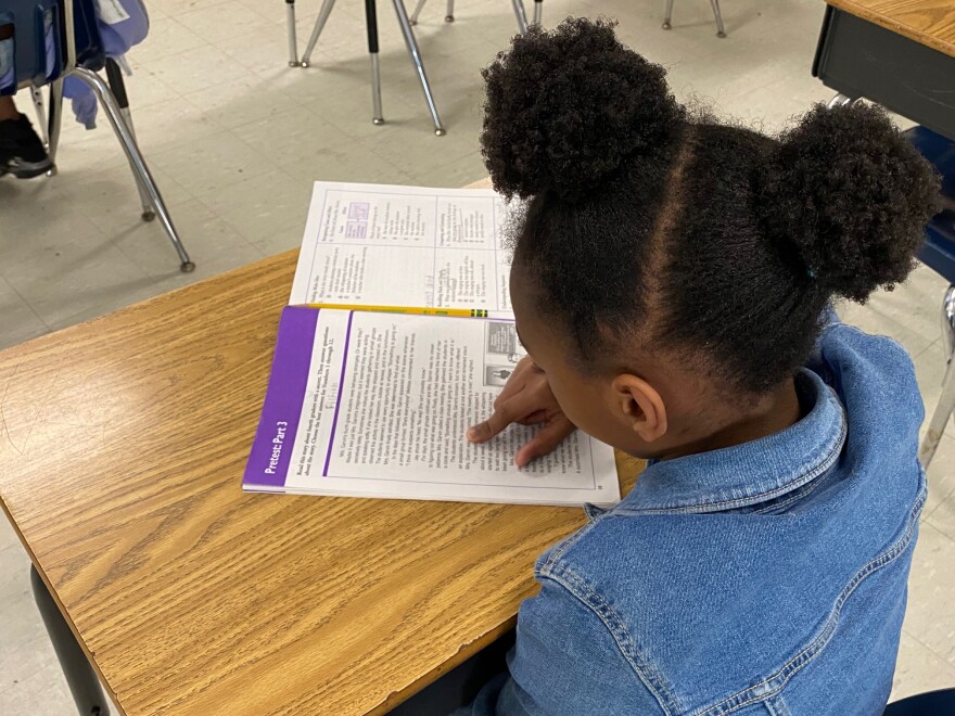 An Allenbrook Elementary student works on reading after school.