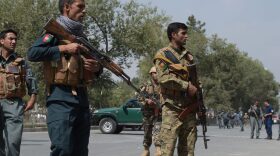 Afghan security personnel keep watch at the site of a suicide attack outside a bank near the US embassy in Kabul on August 29, 2017. (Shah Marai/AFP/Getty Images)