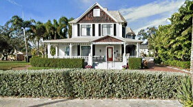 Photo of a two-story house with trees around it 