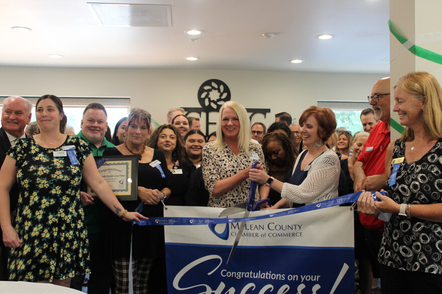 Attendees surround Executive Director Holly Wayland-Hall