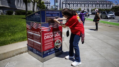 Monica Holguin places a ballot in support of San Francisco City Supervisor and Congressional candidate Connie Chan following a get-out-the-vote rally at City Hall in San Francisco on May, 2026.