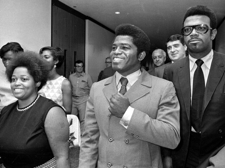 Soul singer James Brown (center) is seen in California in this 1969 file photo. A few years earlier, Brown paid a visit to Virginia, where he gave some advice to Earl Reynolds Jr.