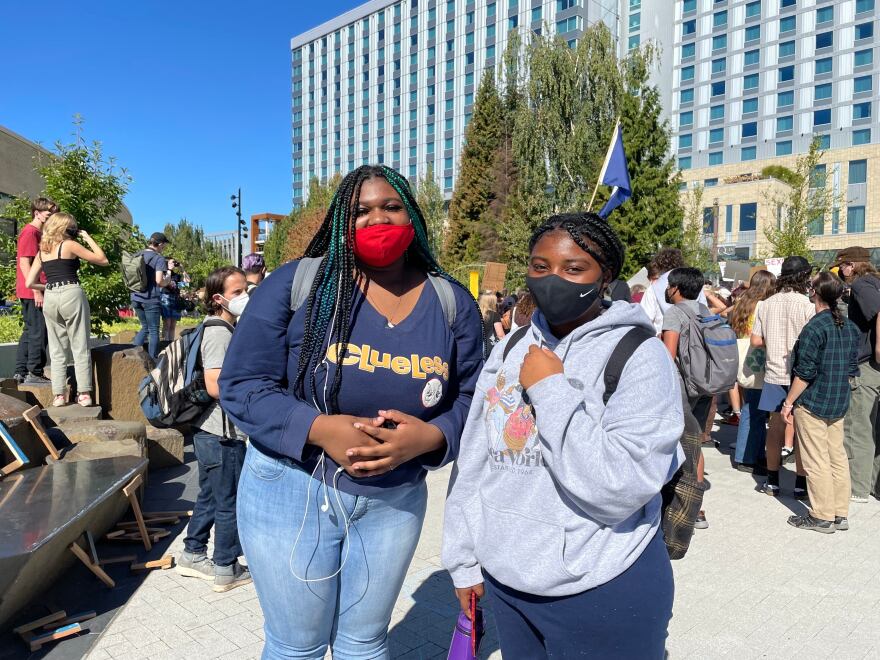Two Portland high school students, who gave their names as Olai (left) and Nyilah. They were among the youths who marched to City Hall on Sept. 24, 2021 to urge policymakers to act to curb carbon emissions that contribute to climate change. It was the first such public gathering since before the COVID-19 pandemic began.
