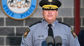 Pennsylvania State Police Commander Colonel Christopher L. Paris, left, speaks at an Aug. 7, 2025 press conference about an ambush in Susquehanna County that left two people dead and two troopers seriously injured.