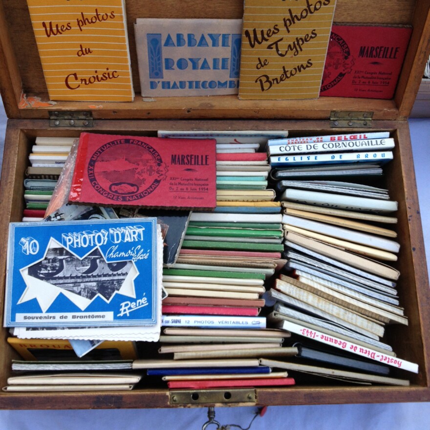 A box of souvenir photos at a Paris flea market