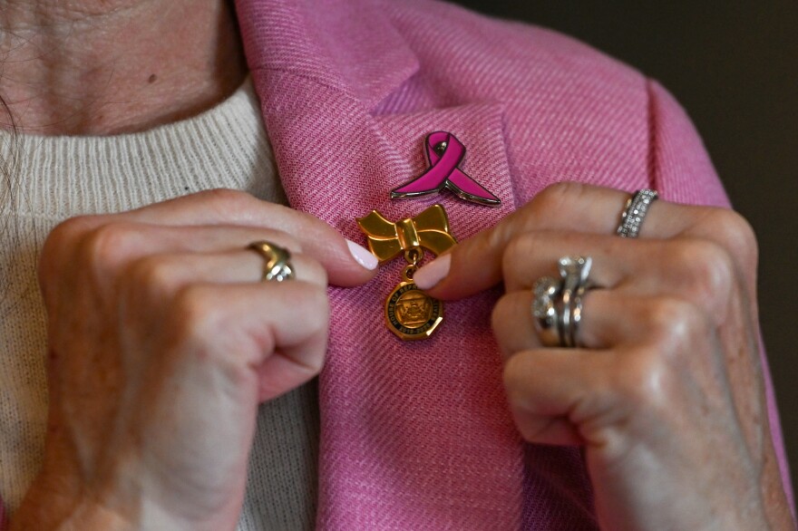 State Rep. Bridget Kosierowski added a breast cancer awareness pin above her state representative pin.
