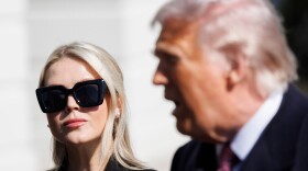 FILE - Press Secretary Karoline Leavitt glances at President Donald Trump before departing on Marine One from the South Lawn of the White House, Feb. 27, 2026, in Washington. (AP Photo/Tom Brenner, File)