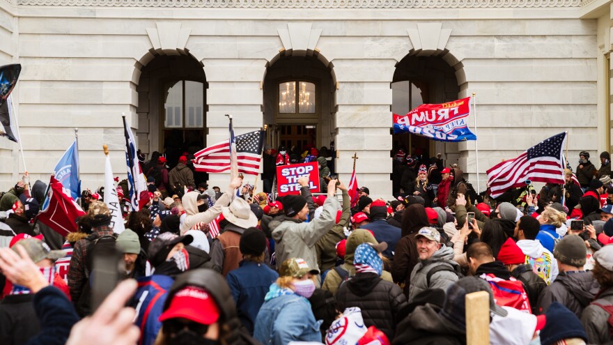 A destructive mob of Trump supporters floods into the U.S. Capitol on Jan. 6. The president was criticized for inciting the rioters and for failing to quell the insurrection.