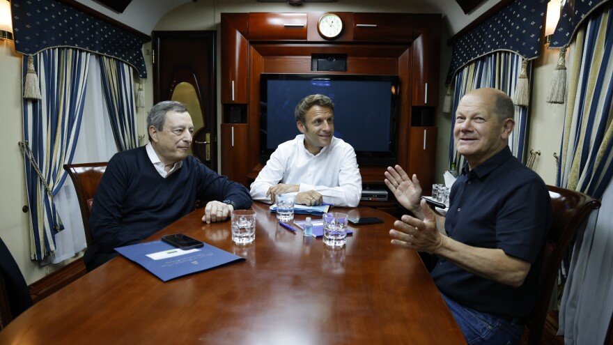 French President Emmanuel Macron (center), German Chancellor Olaf Scholz (right), and Italian Prime Minister Mario Draghi travel by train to Kyiv after departing from Poland. The three leaders met later with Ukraine's President Volodymyr Zelenskyy to talk about the war in Ukraine.