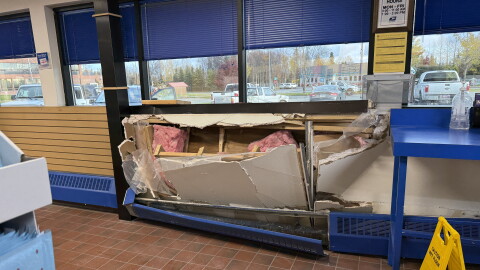 Insulation protrudes from the wall of the Kenai Post Office following a vehicle collision on Tuesday, Oct. 13, 2026 in Kenai, Alaska.