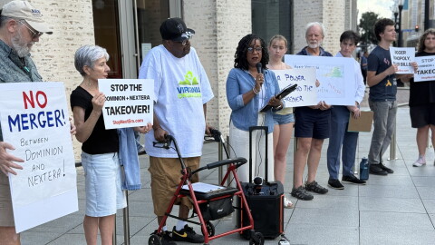 Community advocate Kim Sudderth speaks to the crowd gathered outside Norfolk's Slover library before an event with Lt. Gov. Ghazala Hashmi and local representatives Sept. 8, 2026.