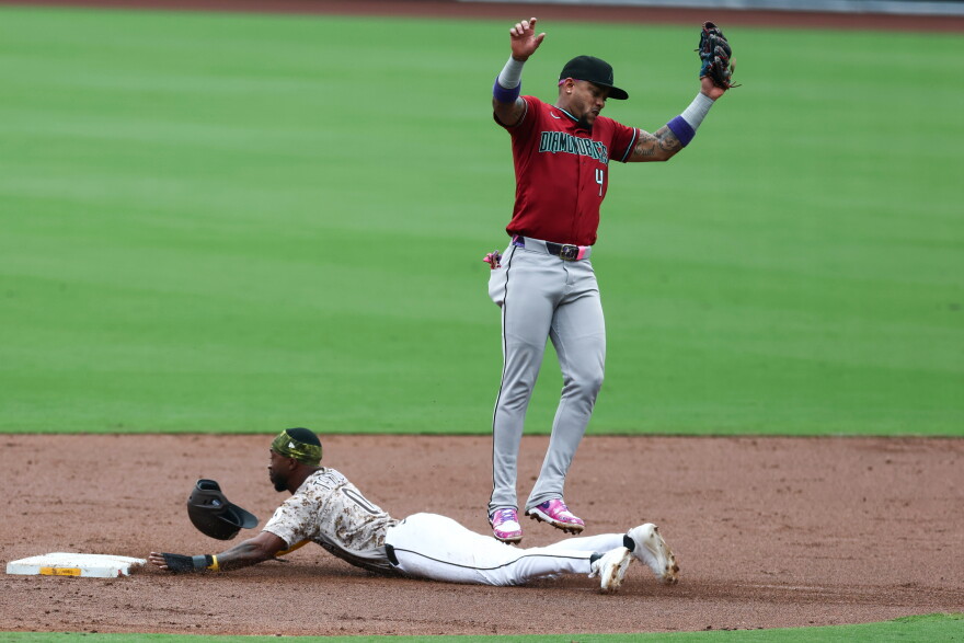 San Diego Padres' Samad Taylor steals second against Arizona Diamondbacks second baseman Ketel Marte in the third inning of a baseball game Sunday, Sept. 27, 2026, in San Diego.