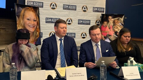 Family members of two of the UPS plane crash victims sit at a table beside their attorneys in Louisville on Dec. 3, 2026. From left: Alexandria Faith