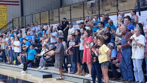 A crowd at Inola High School cheers after their local town council votes unanimously to pass a heavy industry moratorium until next April. At that time there will be a vote of the people to ultimately decide the fate of a massive smelter project in their community.