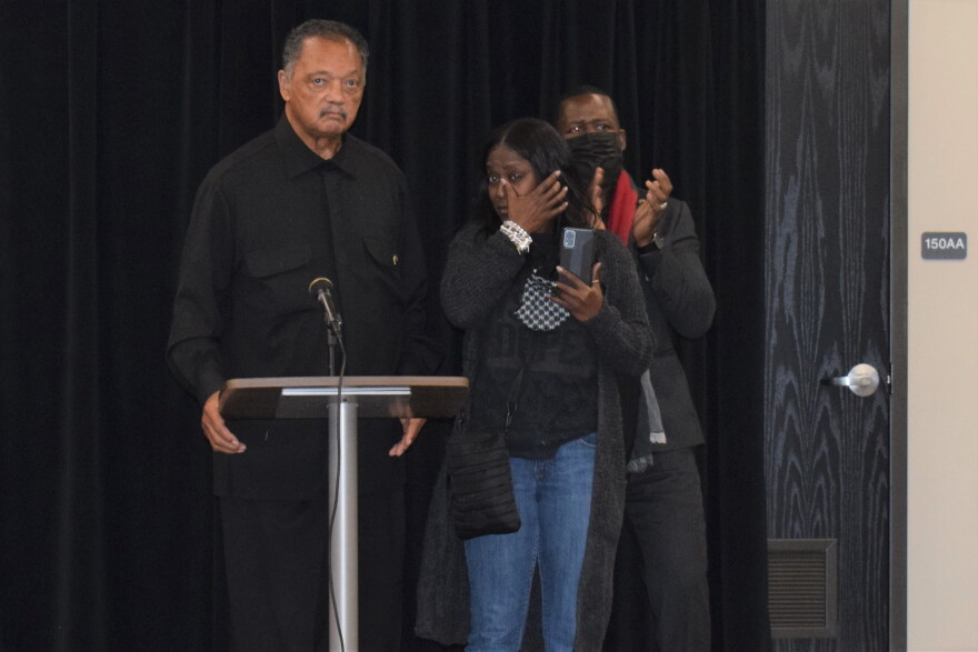 Carmen Bolden Day wipes away a tear as she and Rev. Jesse Jackson speak with members of the ISU Black Student Union ahead of a planned rally in Peru on Tuesday. 