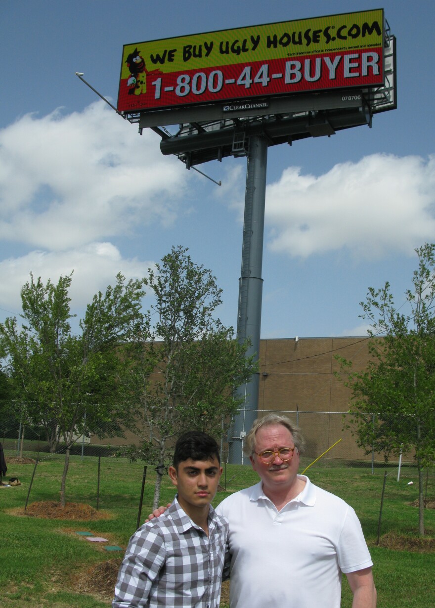 Don Glendenning, president of Scenic Dallas, stands with volunteer Marc Shidid below one of Dallas' new digital billboards.