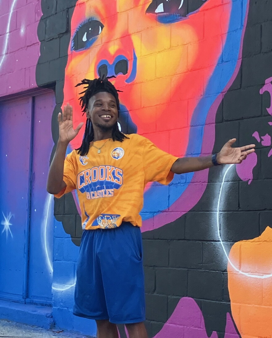 Rock Island's Zay Williams, 31, smiles during his mural dedication in Hilltop Campus Village, Davenport, on Sept. 4, 2026.