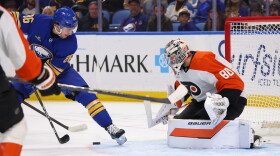 Buffalo Sabres right wing Jack Quinn (22) is stopped by Philadelphia Flyers goaltender Dan Vladar (80) during the first period of an NHL hockey game Wednesday, Oct. 21, 2026, in Buffalo, N.Y. (AP Photo/Jeffrey T. Barnes)