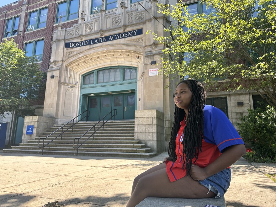 Alana Laforest sits outside Boston Latin Academy on June 15, 2024.