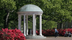 In this file photo, the Old Well on the University of North Carolina at Chapel Hill is seen among the spring foliage. The future of diversity, equity and inclusion staff jobs in North Carolina's public university system could be at stake as a series of votes loom on a key policy's potential repeal. (AP Photo/Gerry Broome)