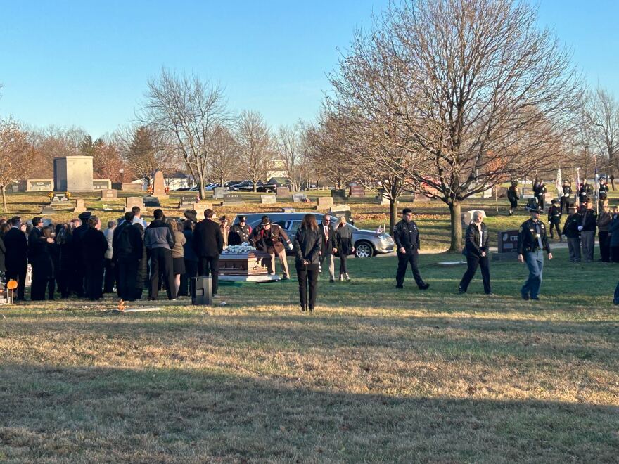 Family, friends and law enforcement officials paying their respects before Reynolds is layed to rest at Jones Cemetery